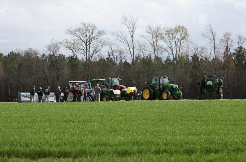 People and tractors in the field at Tidewater AREC.