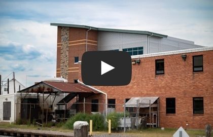 Web - size for site banner header - 1 Thumbnail for video shows new VSAREC facility behind the old one.