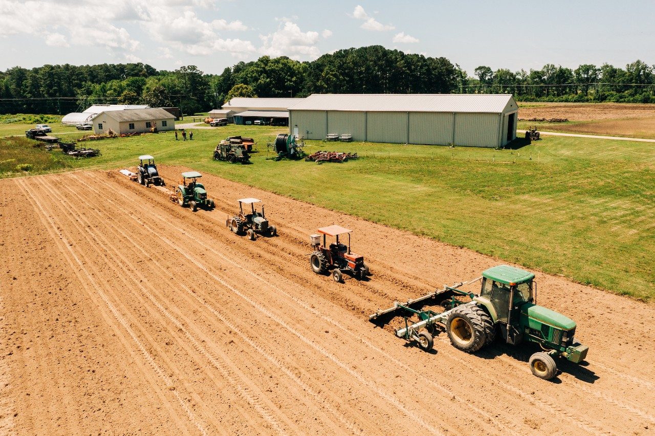 tractors pulling plows