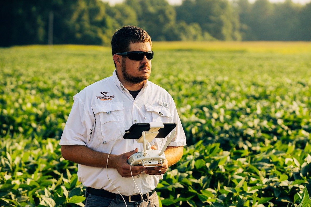 Image of Joseph Oakes in field with technology