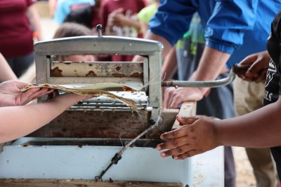 3rd graders using paper making machine