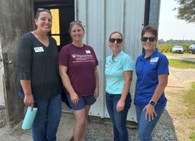 Ladies from Virginia Cooperative Extension chat outside during the cotton field day.