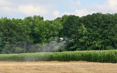A drone flies over a field at Tidewater AREC during a demonstration.