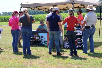 Attendees visit vendor booths at the Precision Ag Expo.