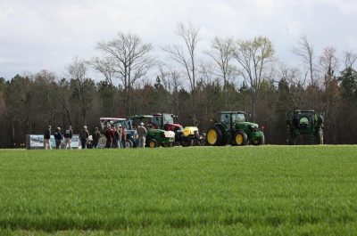 People and tractors in the field at Tidewater AREC.