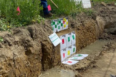 A soil pit demonstration at the cover crop field tour.