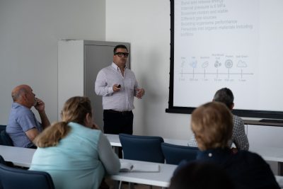 Researcher presenting information about nanobubbles in the Virginia AREC classroom.