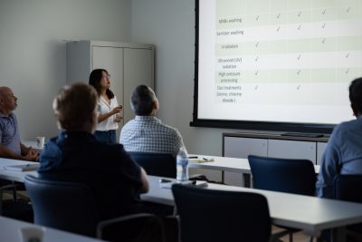 Researcher presenting information about nanobubbles in the Virginia AREC classroom.