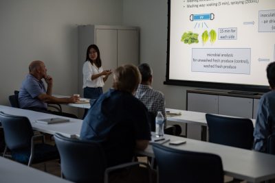 Researcher presenting information about nanobubbles in the Virginia AREC classroom.