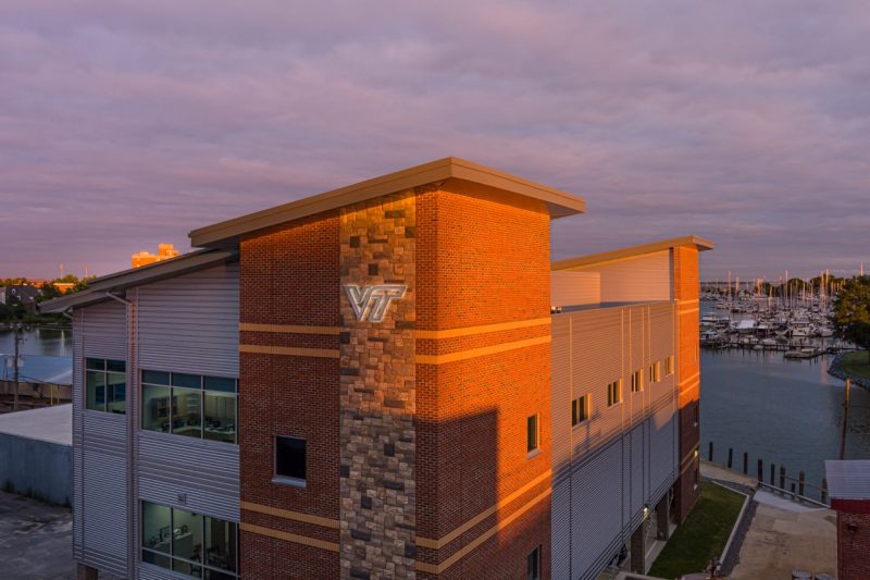 The new Virginia Seafood AREC facility on the Hampton waterfront during sunrise.