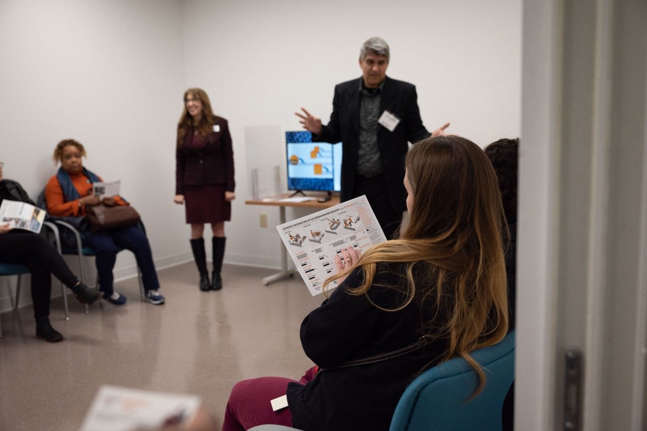 Person looking at infographic during a presentation