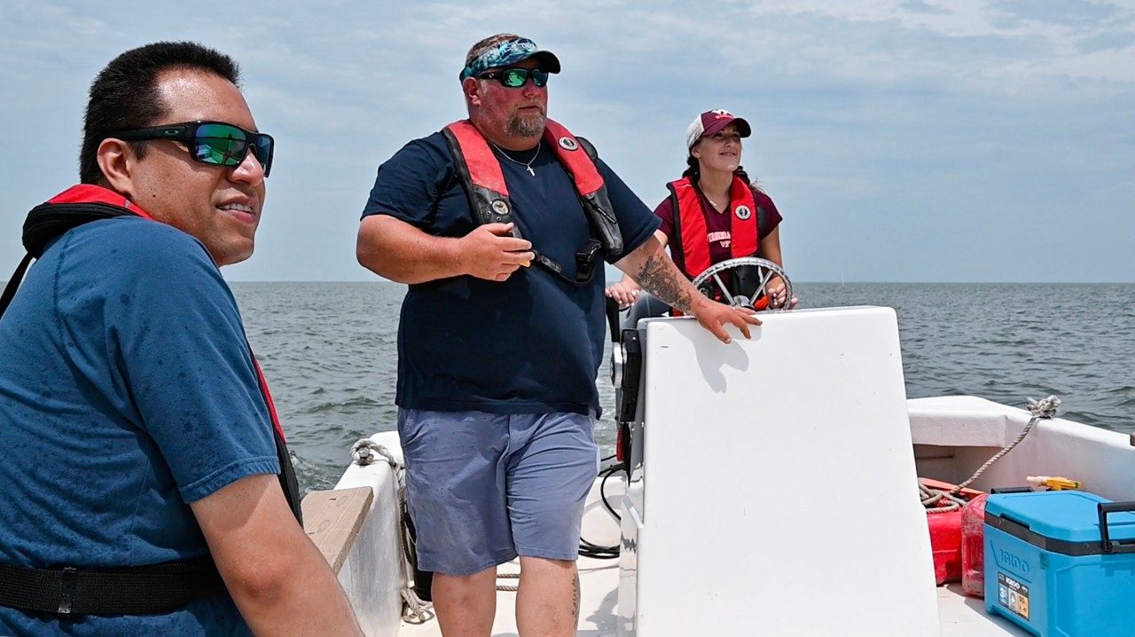 Faculty member and student on boat in the Chesapeake Bay