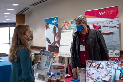 Attendees visit the Virginia Seafood AREC booth at conference